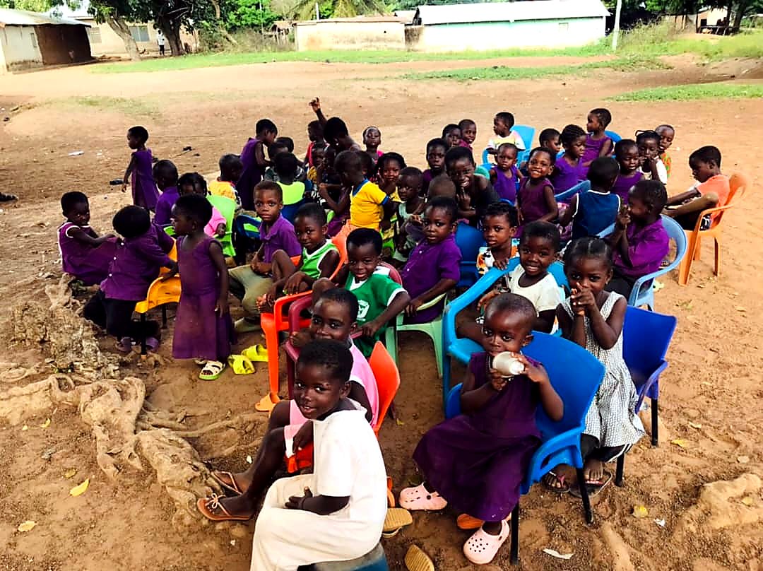 Children gathered for a school outreach program in Ghana